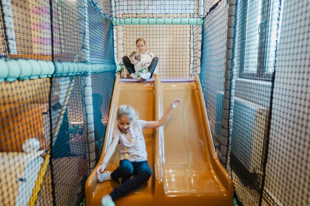 Two children on slide at Wiggle Room