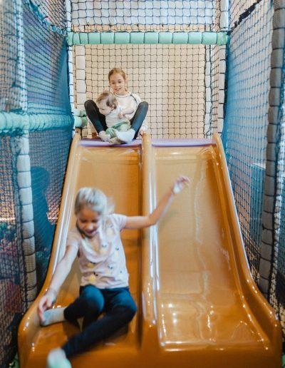 Two children on slide at Wiggle Room
